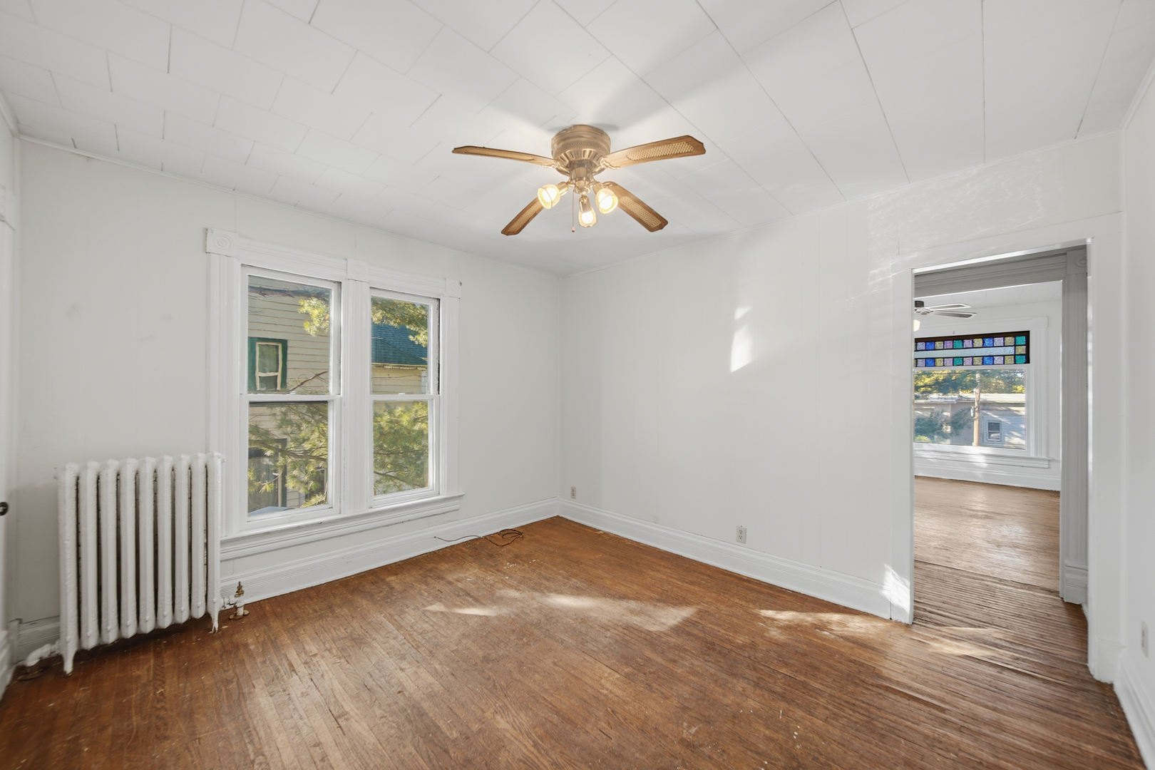 1102 West 3rd Street Dixon, IL 61021 - Photo 29 of 32 wooden floor in an empty room with a window