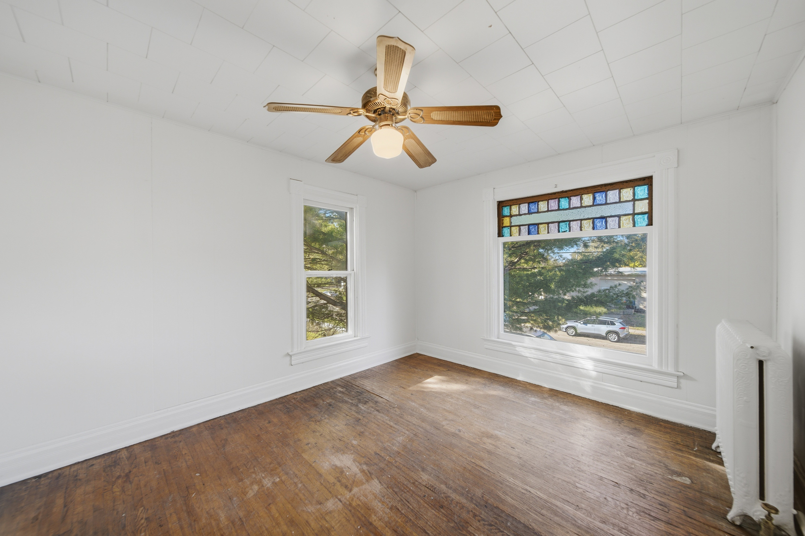 1102 West 3rd Street Dixon, IL 61021 - Photo 30 of 32 a view of an empty room with window and wooden floor