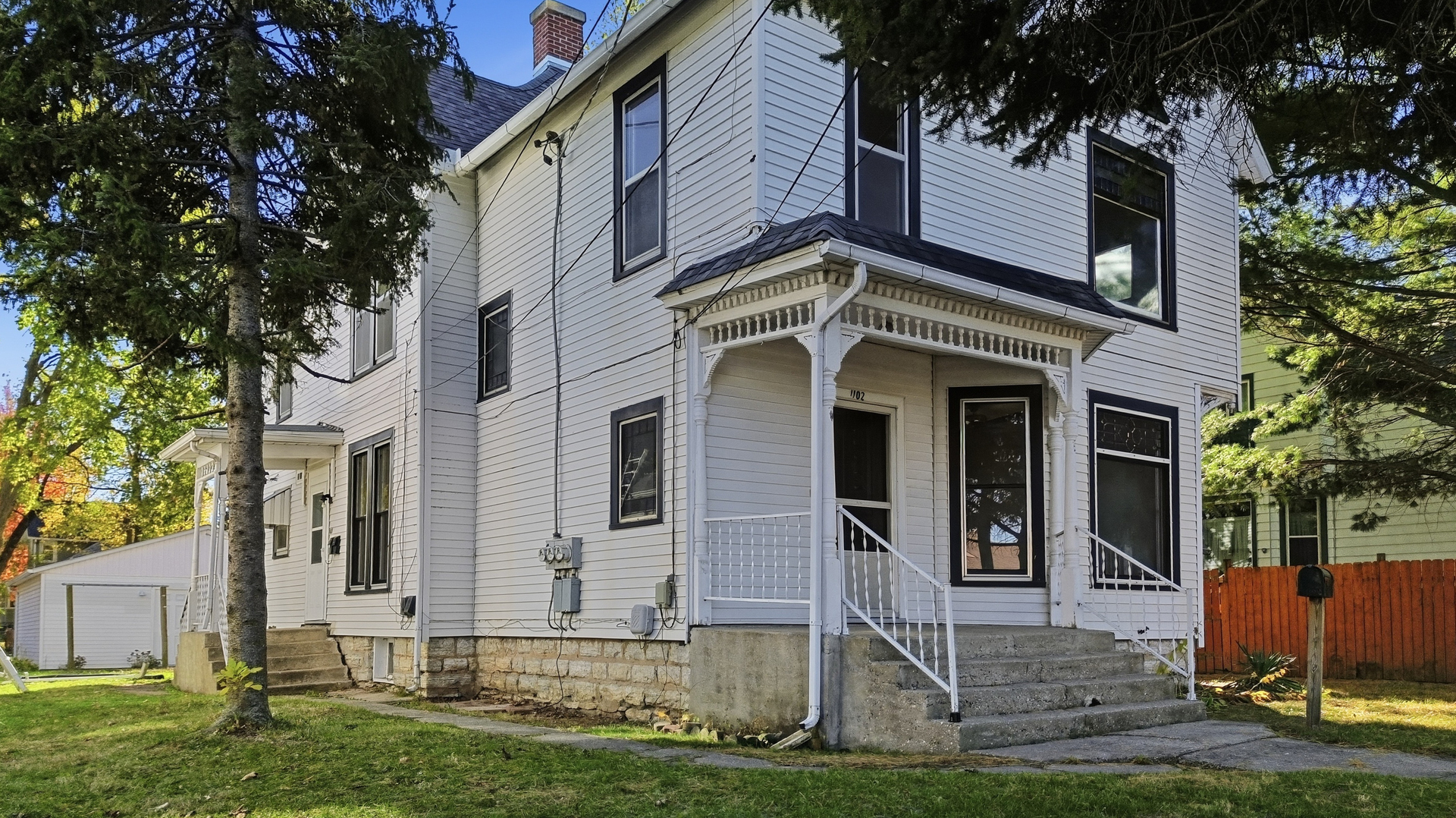 1102 West 3rd Street Dixon, IL 61021 - Photo 3 of 32 a front view of a house with a yard