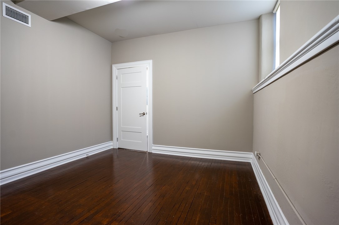 300 Alexander Street, Unit 110 Rochester, NY 14607 - Photo 10 of 14 Nice size bedroom with windows, plank flooring, an