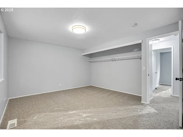 a bathroom with a sink mirror and a shower