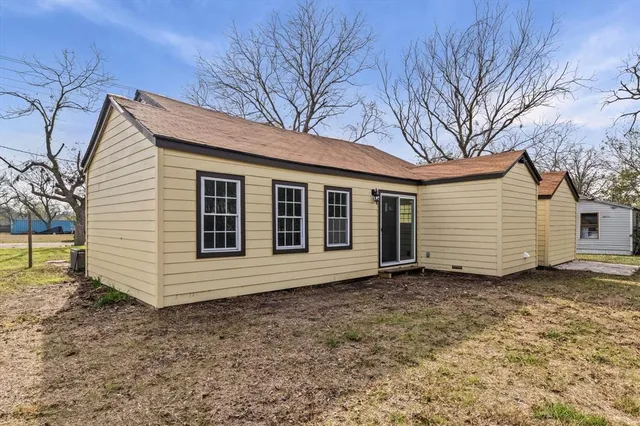 a view of a yard with trees