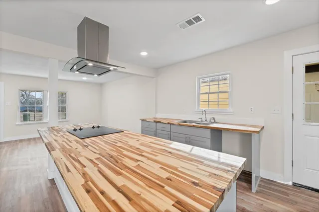 a kitchen with a stove and a sink