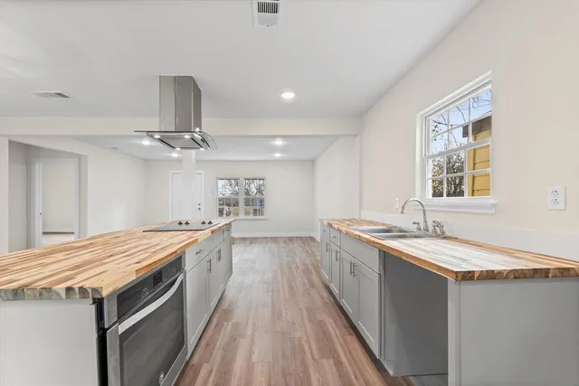 a view of a room with wooden floor