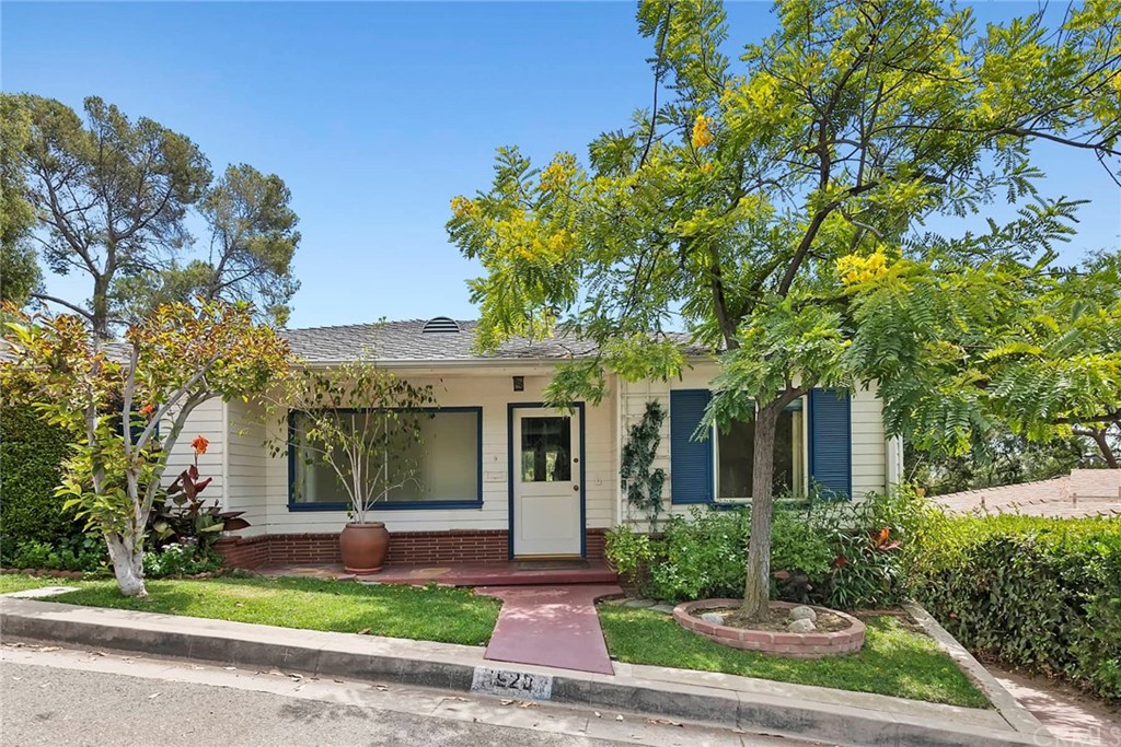 1620 Puebla Drive Glendale, CA 91207 - Photo 1 of 34 a front view of a house with a yard and potted plants