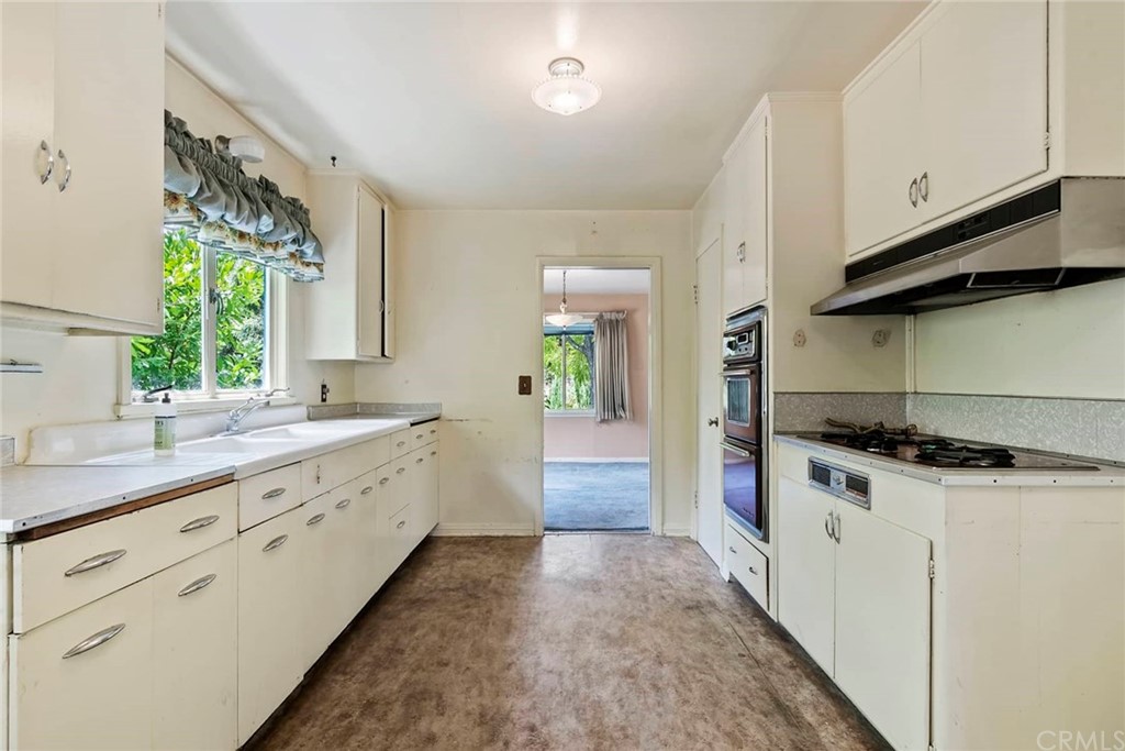 1620 Puebla Drive Glendale, CA 91207 - Photo 14 of 34 a kitchen with granite countertop a sink and a stove