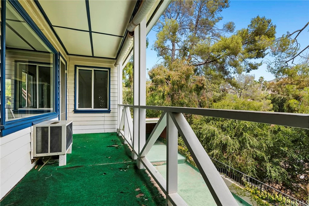 1620 Puebla Drive Glendale, CA 91207 - Photo 16 of 34 a view of balcony with wooden floor and fence