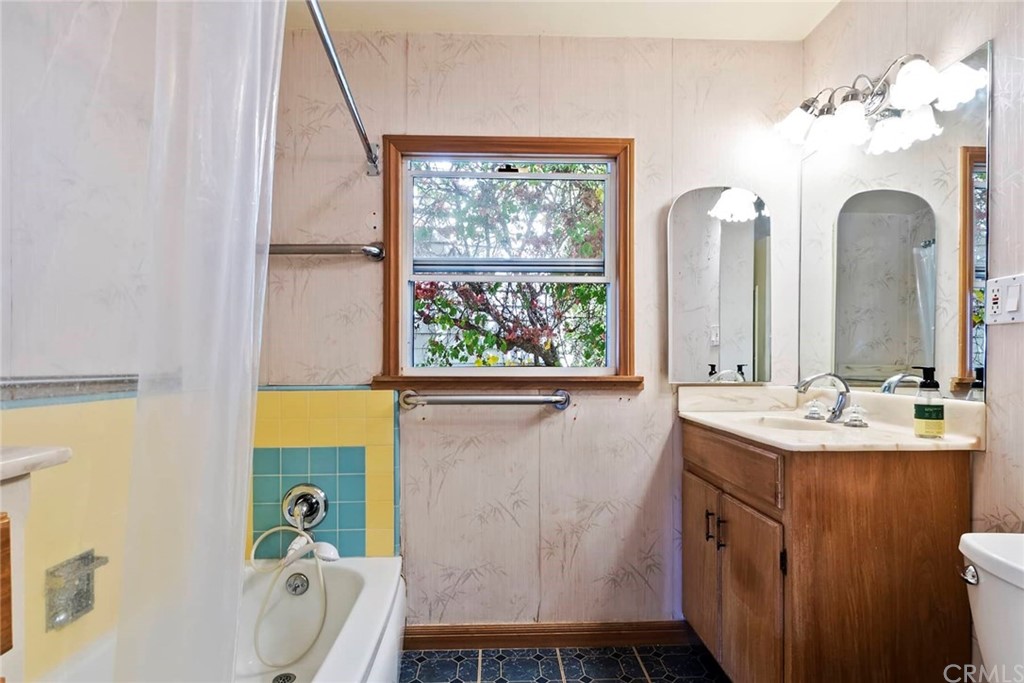 1620 Puebla Drive Glendale, CA 91207 - Photo 20 of 34 a bathroom with a sink a bathtub and a window