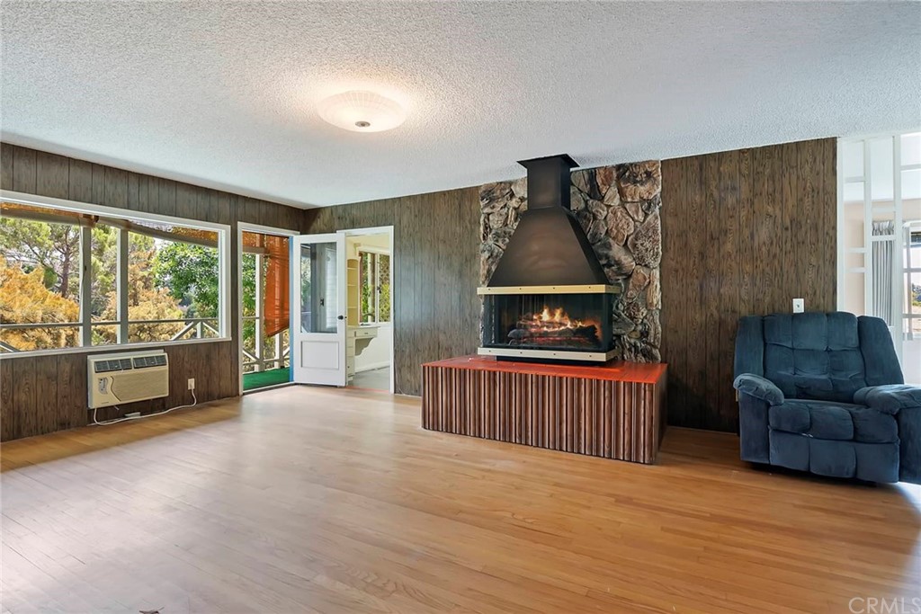 1620 Puebla Drive Glendale, CA 91207 - Photo 8 of 34 a living room with furniture and a fireplace