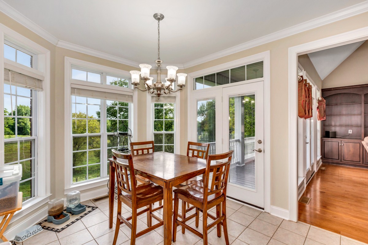 7388 Prospect Road Prospect, TN 38477 - Photo 13 of 46 a view of a dining room with furniture wooden floor and chandelier