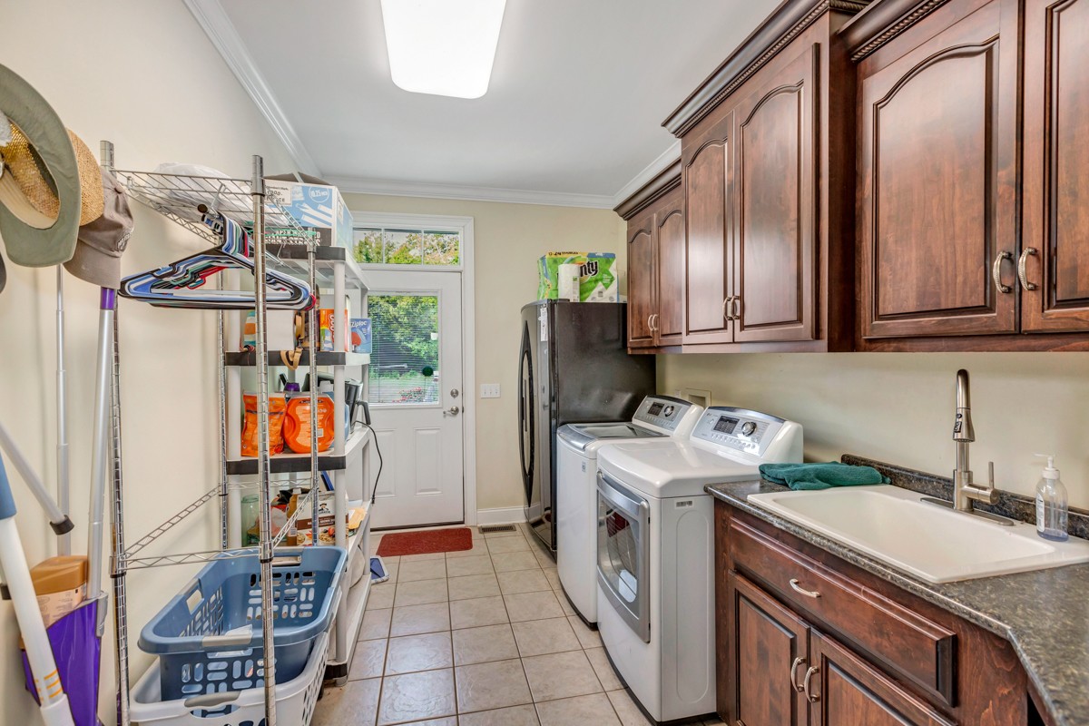 7388 Prospect Road Prospect, TN 38477 - Photo 15 of 46 a storage room with washer and dryer