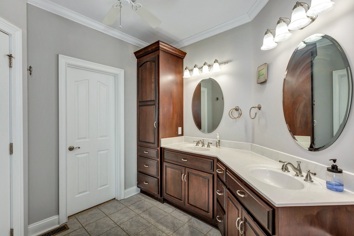 7388 Prospect Road Prospect, TN 38477 - Photo 19 of 46 a en suite bathroom with a double vanity sink and a mirror