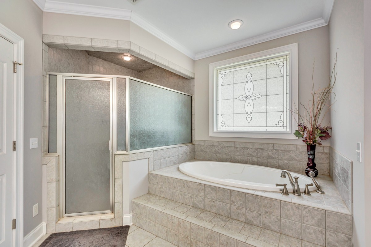 7388 Prospect Road Prospect, TN 38477 - Photo 20 of 46 a bathroom with a bathtub and a shower