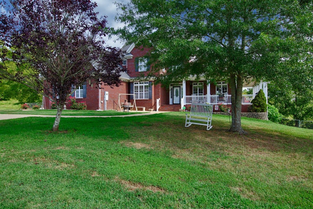 7388 Prospect Road Prospect, TN 38477 - Photo 2 of 46 a view of a house with a yard
