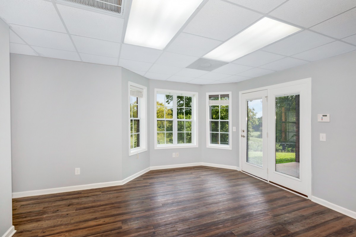 7388 Prospect Road Prospect, TN 38477 - Photo 35 of 46 a view of an empty room with wooden floor and a window