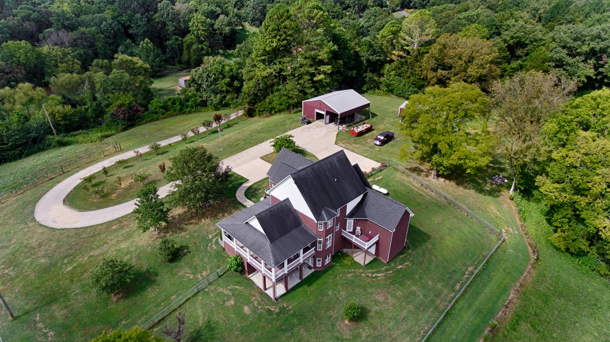 7388 Prospect Road Prospect, TN 38477 - Photo 44 of 46 an aerial view of a house with swimming pool a yard and mountain