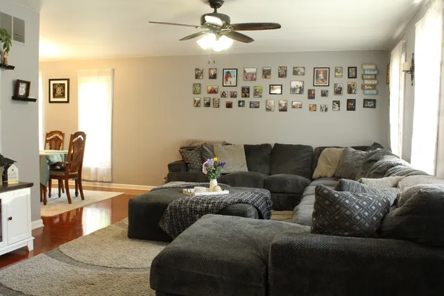 a living room with furniture and a window