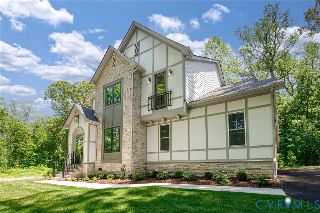 8919 Rustic Road Richmond, VA 23235 - Photo 3 of 36 Stone and siding exterior with dark framed windows