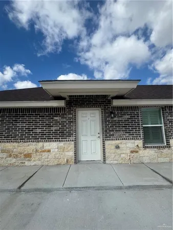 a front view of a house with a garage