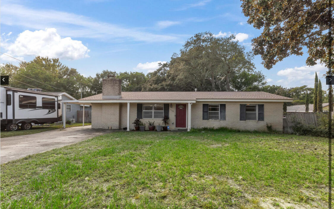 118 Baker Avenue Northwest Fort Walton Beach, FL 32548 - Photo 1 of 19 a view of a house with a yard