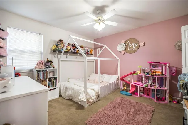 a bedroom with furniture and a chandelier