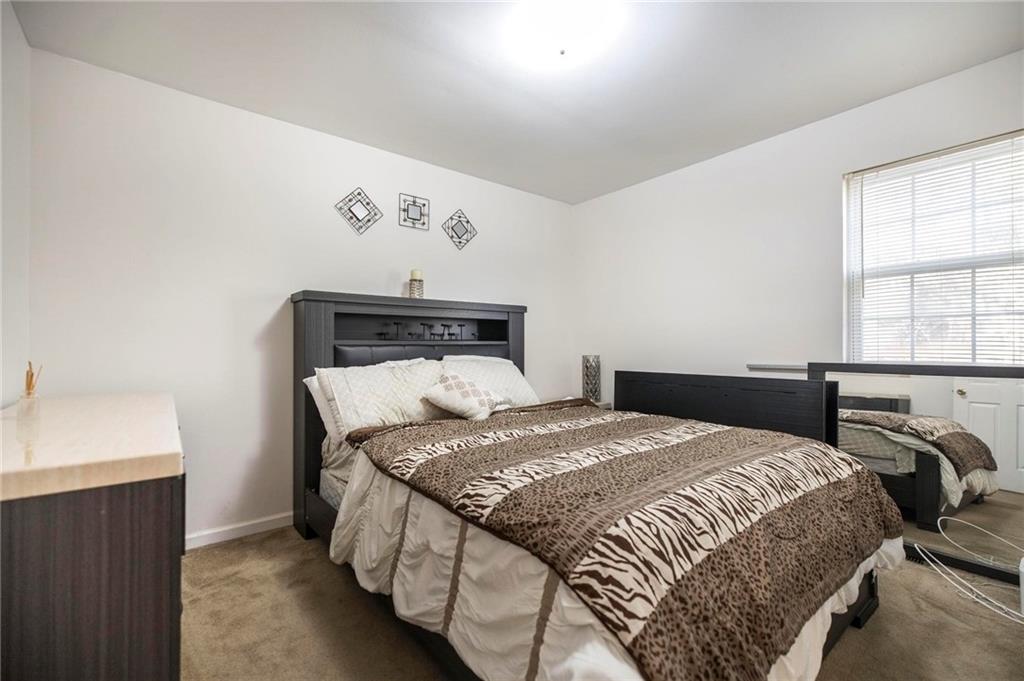 306 Jason Court Macon, GA 31216 - Photo 23 of 30 a bedroom with a bed and window