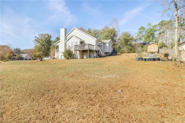 a view of a house with snow on the road