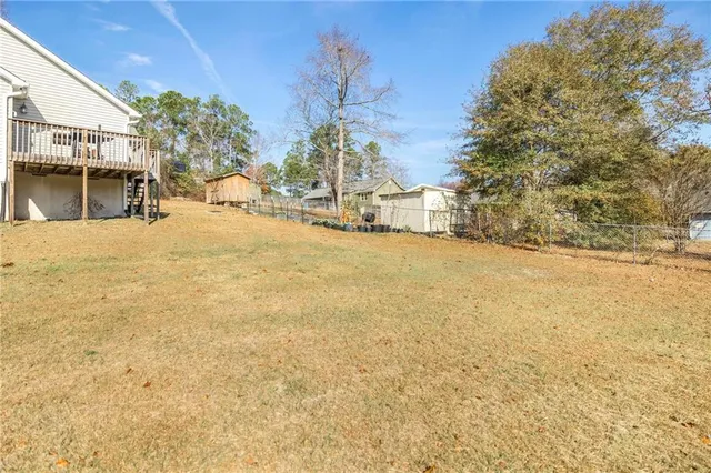 a view of a backyard of the house