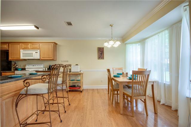 1920 Portway Road Spring Hill, TN 37174 - Photo 3 of 10 a view of a dining room with furniture and wooden floor