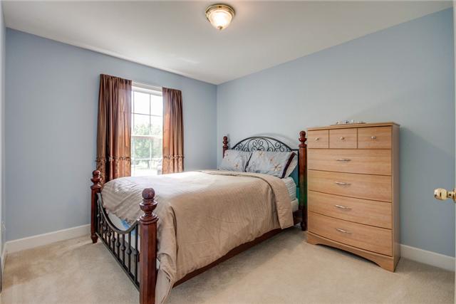 1920 Portway Road Spring Hill, TN 37174 - Photo 5 of 10 a bedroom with a bed and a window