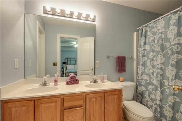 1920 Portway Road Spring Hill, TN 37174 - Photo 7 of 10 a bathroom with a sink vanity mirror and toilet