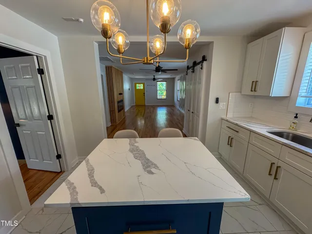 a kitchen with a sink and a refrigerator