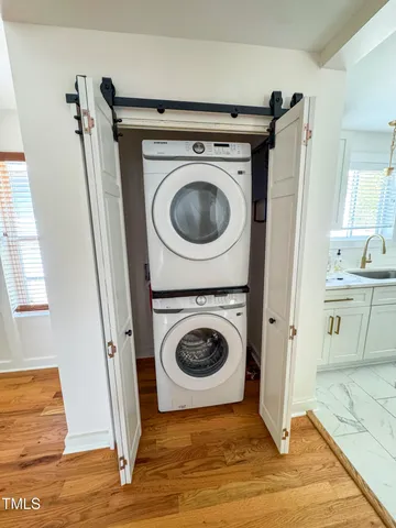 a view of a storage and utility room with a washer dryer