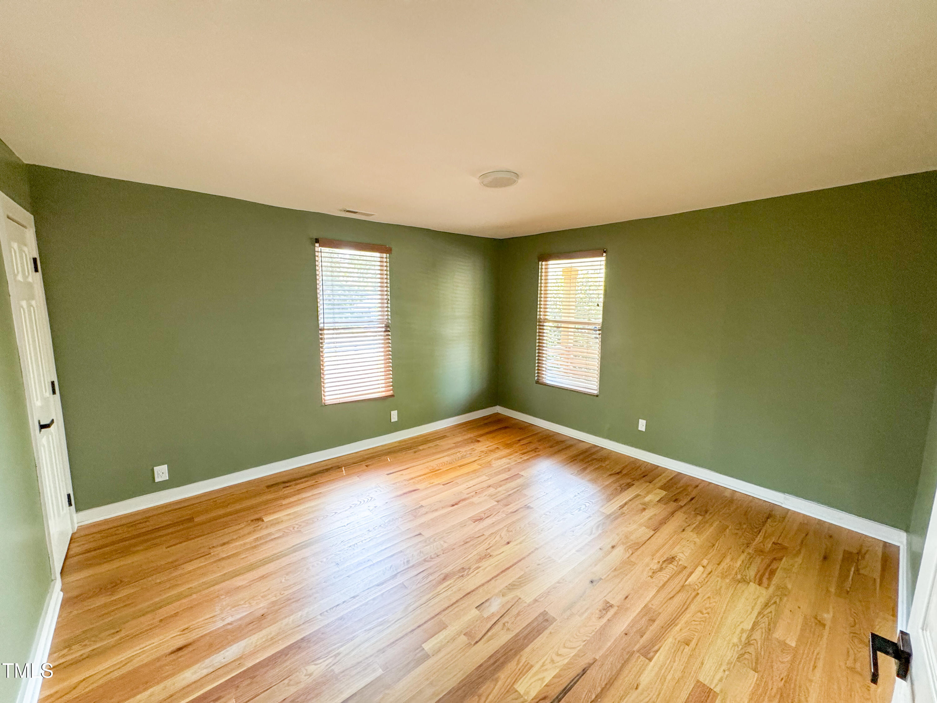 1100 Chester Street Durham, NC 27701 - Photo 17 of 29 a view of empty room with window and wooden floor