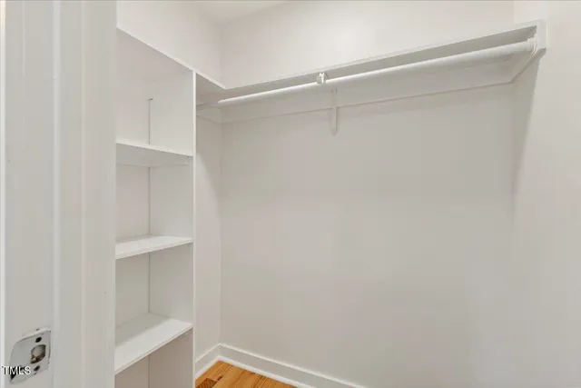 a view of an empty walk in closet