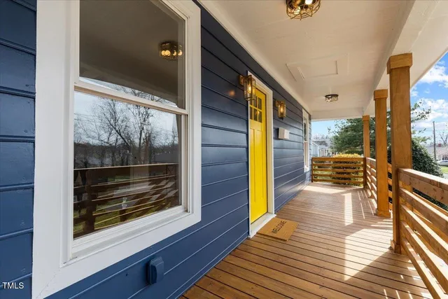 a view of a balcony with wooden floor