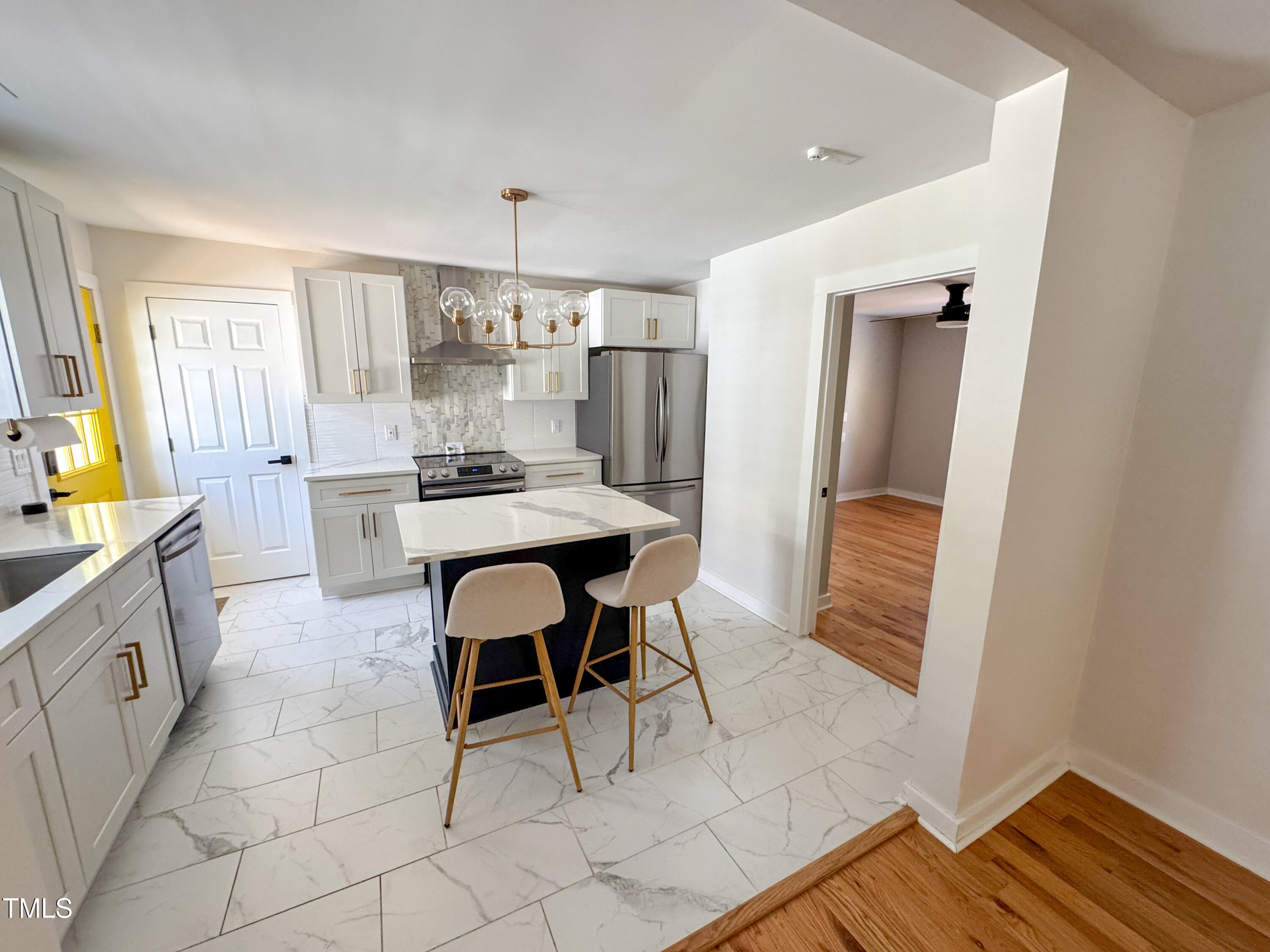 1100 Chester Street Durham, NC 27701 - Photo 9 of 29 a kitchen with a sink cabinets and window