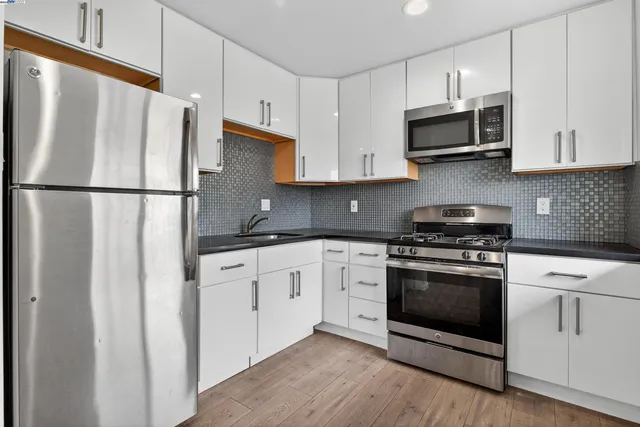 a bathroom with a sink a toilet and bathtub