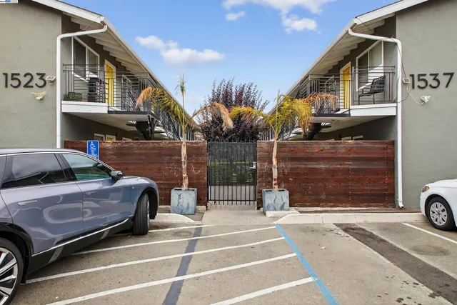 a view of cars parked in front of a house