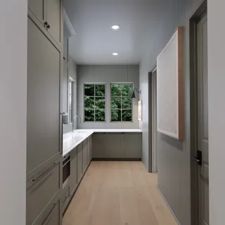 a large white kitchen with a large window
