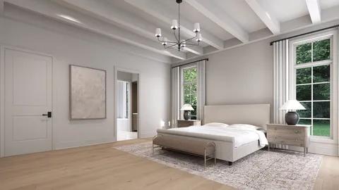 a bedroom with a large bed a chandelier and windows