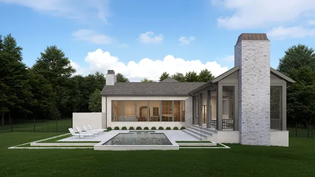 a front view of house with a garden and patio