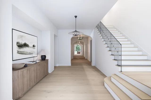 a view of a hallway with stairs