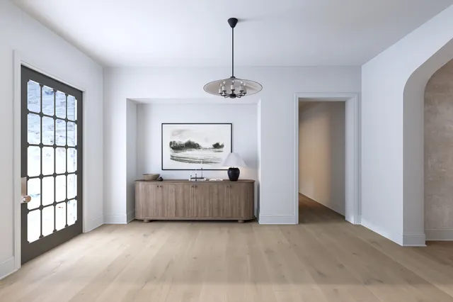 a view of a room with furniture wooden floor and window