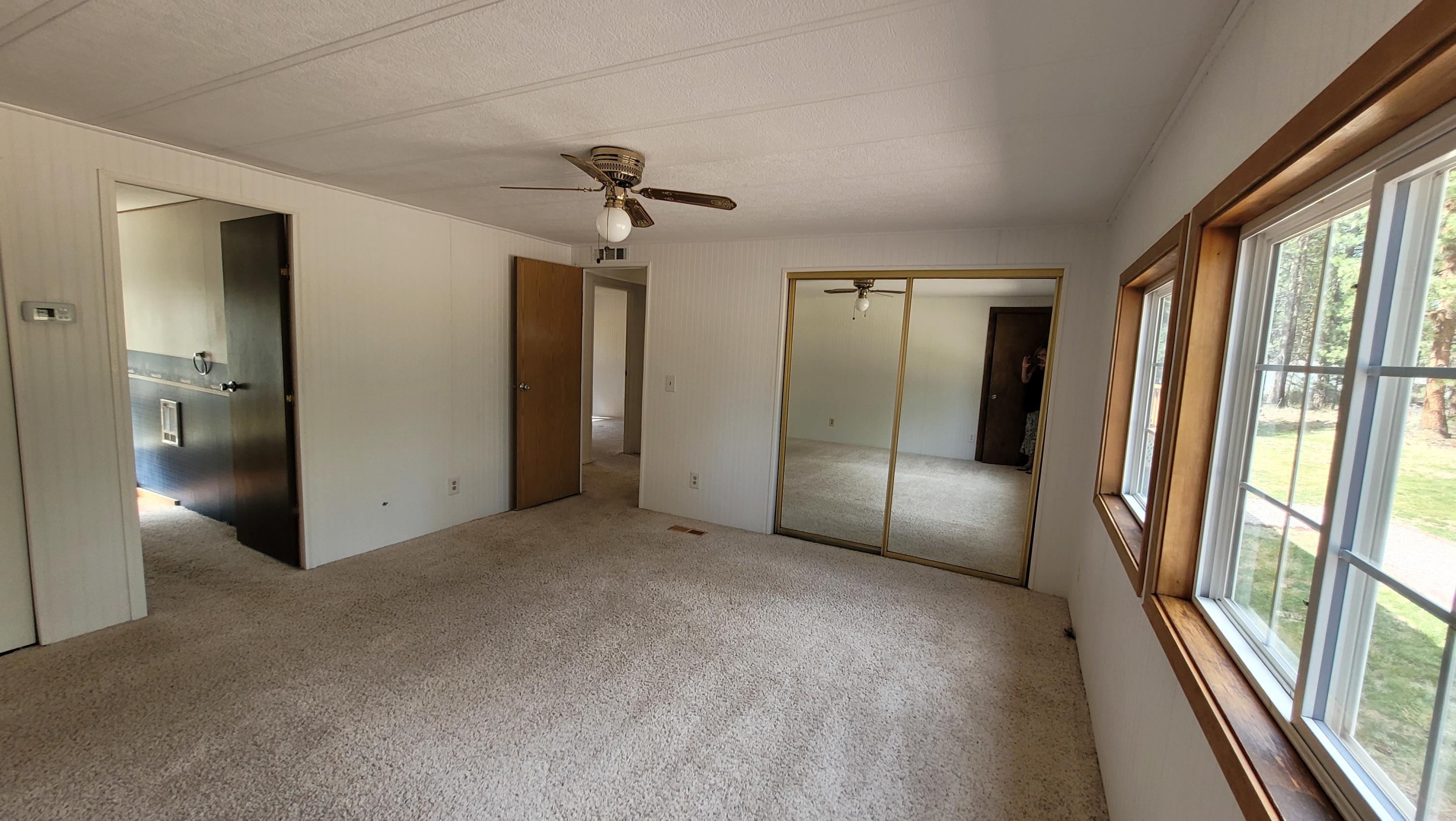 19724 Buck Canyon Road Bend, OR 97702 - Photo 25 of 38 Master bedroom has 2 standard closets plus a huge walk in closet.
