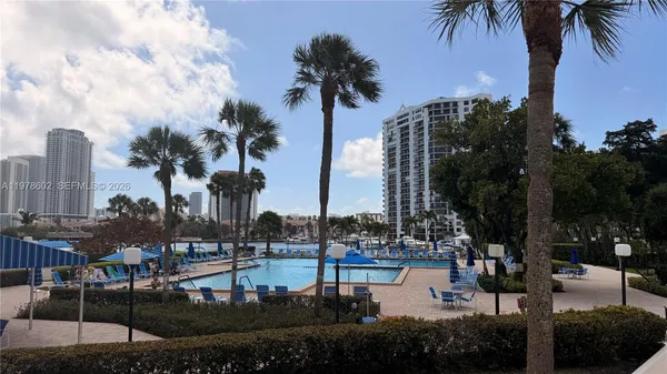 a view of water with palm trees