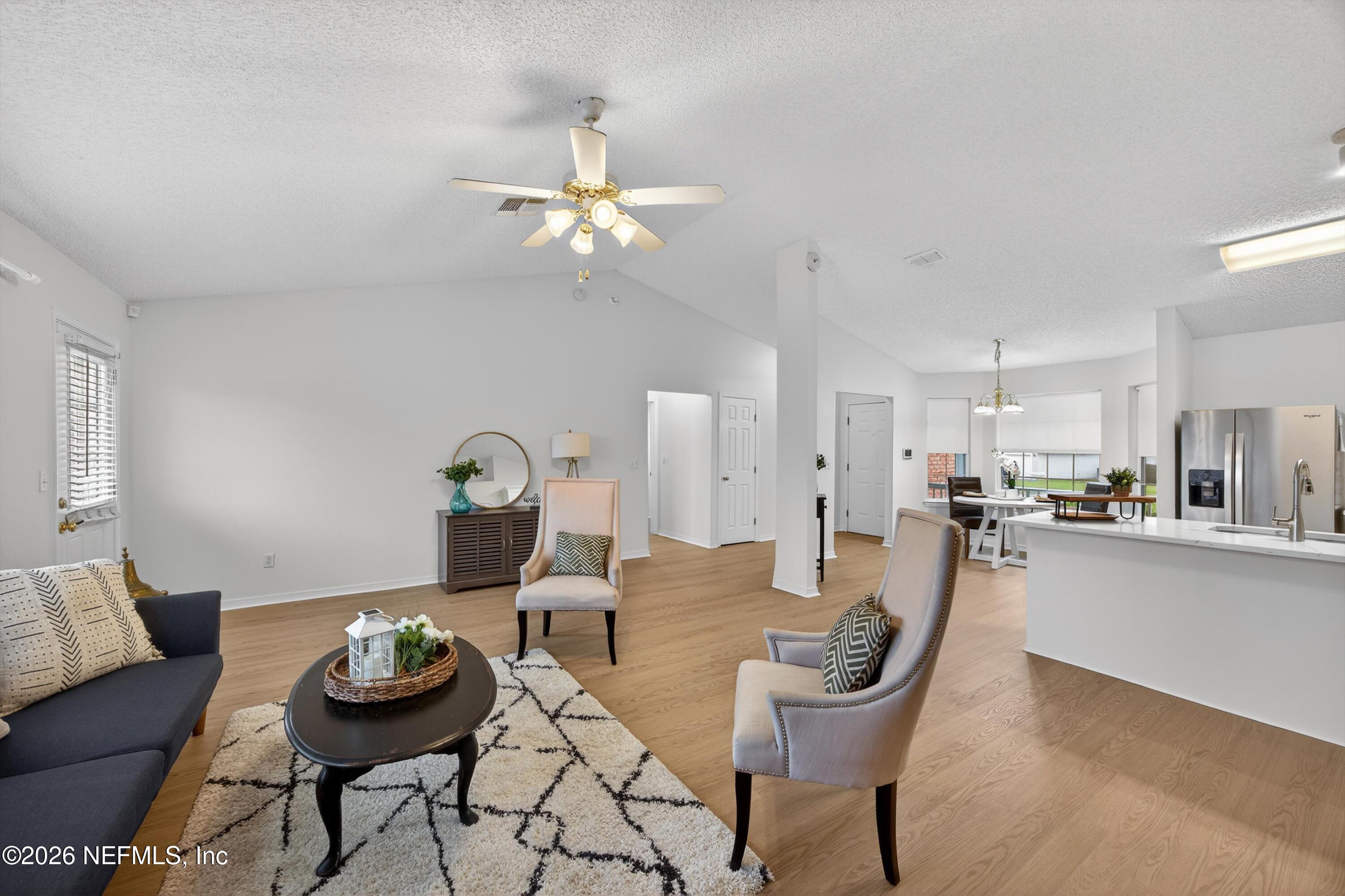 2411 Paris Mill Road Jacksonville, FL 32221 - Photo 11 of 36 a living room with furniture and kitchen view