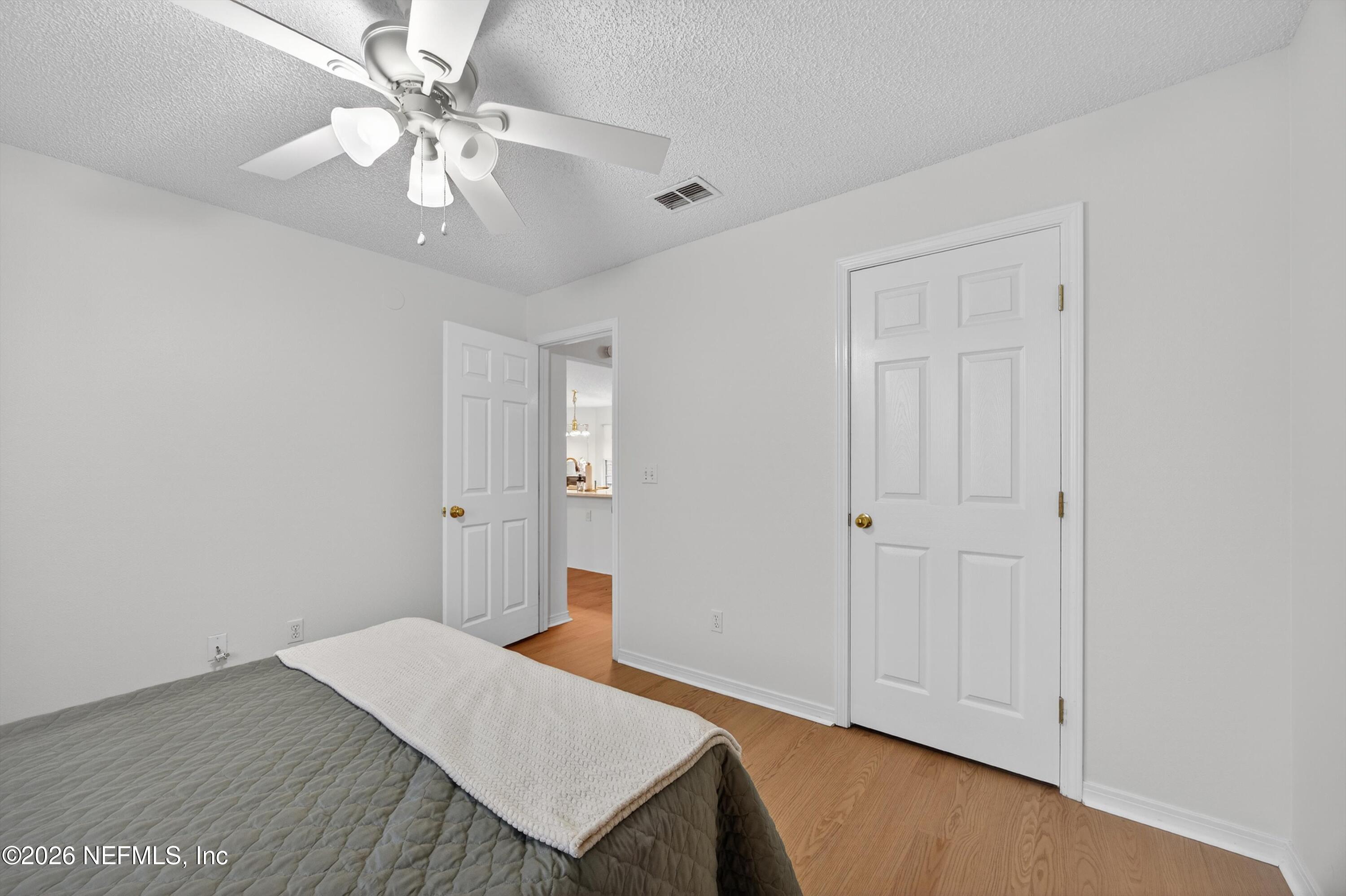 2411 Paris Mill Road Jacksonville, FL 32221 - Photo 29 of 36 wooden floor in an empty room with a window
