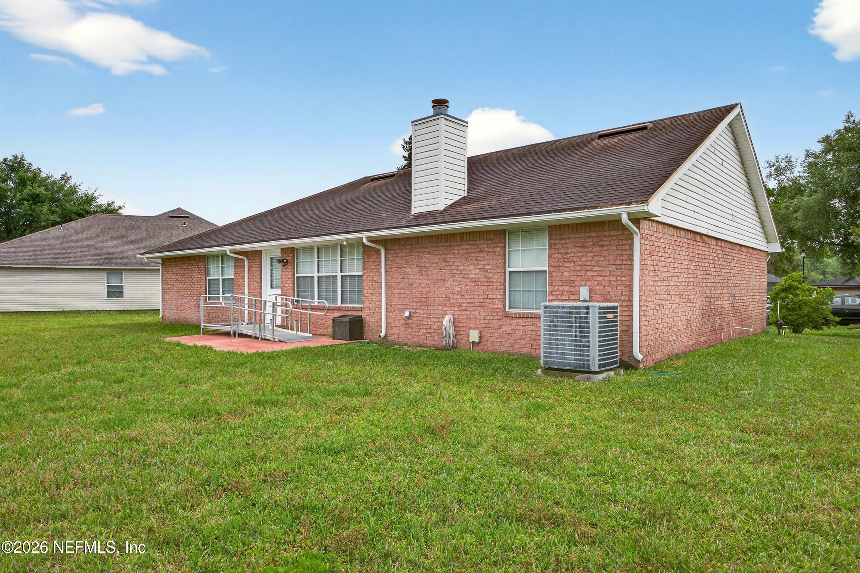 2411 Paris Mill Road Jacksonville, FL 32221 - Photo 33 of 36 a front view of a house with yard