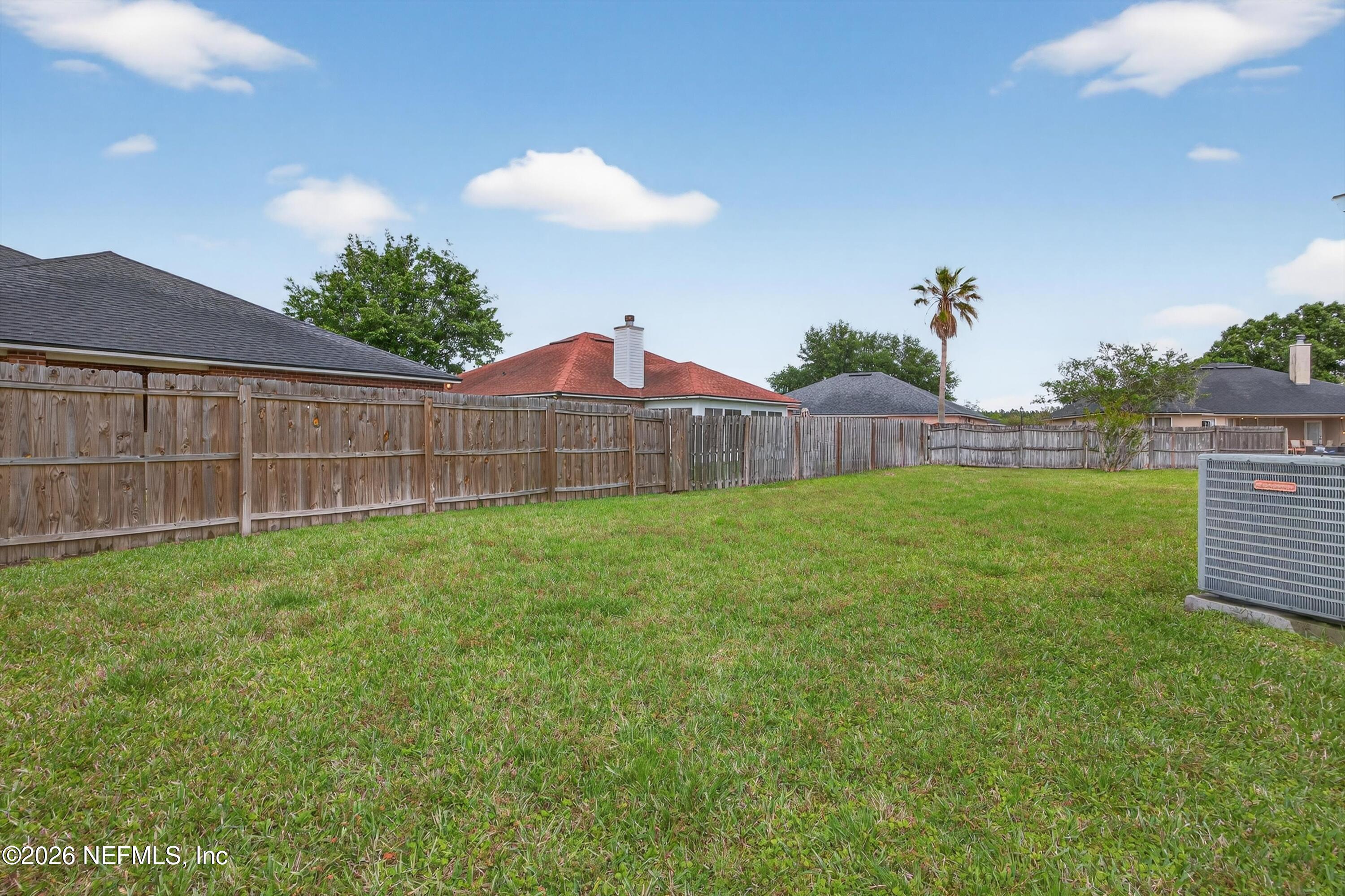 2411 Paris Mill Road Jacksonville, FL 32221 - Photo 34 of 36 a view of a backyard with a garden
